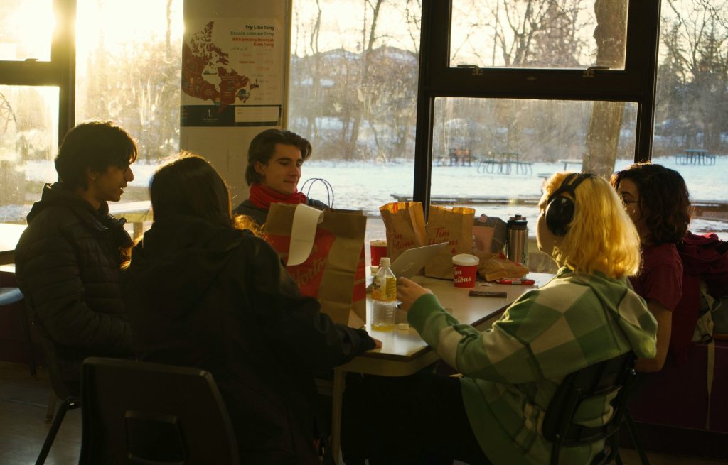 a group of people sitting around a table